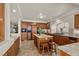Traditional kitchen with custom wood cabinets, a central island, and granite countertops at 4439 Melrose Abbey Pl, Las Vegas, NV 89141