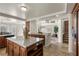 Bright kitchen boasts a center island, sleek appliances, and views into other living areas at 4439 Melrose Abbey Pl, Las Vegas, NV 89141
