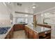 Well-lit kitchen with granite countertops, a central island, and ample counter space at 4439 Melrose Abbey Pl, Las Vegas, NV 89141