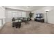 Comfortable loft space with corner bay window, plush sofa, and stylish decor at 4439 Melrose Abbey Pl, Las Vegas, NV 89141