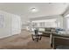 Cozy loft area with comfortable seating, neutral colors, and plenty of natural light at 4439 Melrose Abbey Pl, Las Vegas, NV 89141