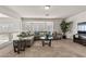 Comfortable loft area with a sectional sofa, modern decor, and scenic views at 4439 Melrose Abbey Pl, Las Vegas, NV 89141