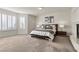 Comfortable bedroom with neutral tones, plantation shutters, and stylish bedside tables at 4439 Melrose Abbey Pl, Las Vegas, NV 89141