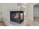 Close-up of bedroom fireplace, with Primary bath and walk-in closet in the background at 4439 Melrose Abbey Pl, Las Vegas, NV 89141