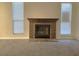 Brick fireplace with a wood mantel in the living room at 4708 Obannon Dr # C, Las Vegas, NV 89102