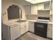 Clean kitchen with white cabinets and new flooring at 4708 Obannon Dr # C, Las Vegas, NV 89102