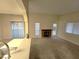 Open living room with kitchen passthrough and access to patio at 4708 Obannon Dr # C, Las Vegas, NV 89102