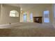 Bright living room featuring a fireplace and carpet flooring at 4708 Obannon Dr # C, Las Vegas, NV 89102