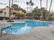 Inviting community pool with surrounding patio and lounge chairs at 4708 Obannon Dr # C, Las Vegas, NV 89102