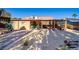 Backyard with desert landscaping, playhouse, and covered patio with outdoor kitchen at 5873 Corazon Dr, Las Vegas, NV 89103