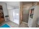 Bathroom with a shower and storage cabinet, plus a shower-tub combination at 5873 Corazon Dr, Las Vegas, NV 89103