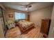 Charming bedroom with wood floors, ceiling fan, and cozy decor at 5873 Corazon Dr, Las Vegas, NV 89103