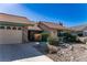 Charming single-story home with desert landscape and a two-car garage at 5873 Corazon Dr, Las Vegas, NV 89103