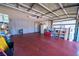 Spacious garage with ample storage cabinets and overhead lighting, perfect for organization at 5873 Corazon Dr, Las Vegas, NV 89103
