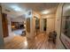 Bright hallway with wood flooring, leading to the living room and bedrooms at 5873 Corazon Dr, Las Vegas, NV 89103