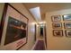 Hallway with natural light from skylight, decorated with Van Gogh art and Gathering photos at 5873 Corazon Dr, Las Vegas, NV 89103