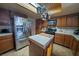 Kitchen featuring central island, stainless steel refrigerator, and pot rack at 5873 Corazon Dr, Las Vegas, NV 89103