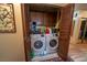 Convenient laundry closet features a stacked washer and dryer, providing efficient use of space at 5873 Corazon Dr, Las Vegas, NV 89103