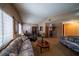 Bright living room with carpet floor, vaulted ceilings, and comfortable sofas at 5873 Corazon Dr, Las Vegas, NV 89103