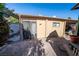 Backyard featuring a storage shed, desert landscaping, and mature trees at 5873 Corazon Dr, Las Vegas, NV 89103