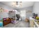 Cozy bedroom with loft bed, ceiling fan, and gray laminate flooring at 5940 Palmilla St # 9, North Las Vegas, NV 89031