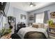 Comfortable bedroom with natural light, gray walls, and a cozy bed with decorative pillows at 5940 Palmilla St # 9, North Las Vegas, NV 89031