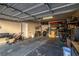 Spacious garage with a variety of items including bikes, boxes, and tools at 5940 Palmilla St # 9, North Las Vegas, NV 89031