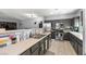 Functional kitchen with stainless steel appliances and open layout connects to the living area, perfect for cooking and entertaining at 5940 Palmilla St # 9, North Las Vegas, NV 89031