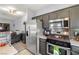 Cozy kitchen has stainless steel appliances and opens to a comfortable living space, great for easy living at 5940 Palmilla St # 9, North Las Vegas, NV 89031