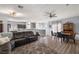 Open floor plan with wood floors and a spacious living area provides ample room to relax and entertain at 5940 Palmilla St # 9, North Las Vegas, NV 89031