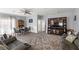 Spacious living room with wood floors and open floor plan perfect for gathering and relaxation at 5940 Palmilla St # 9, North Las Vegas, NV 89031