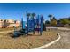Colorful playground structure with slides and climbing features in a park setting at 5940 Palmilla St # 9, North Las Vegas, NV 89031