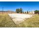Sandy volleyball court in a grassy park area with surrounding neighborhood views at 5940 Palmilla St # 9, North Las Vegas, NV 89031