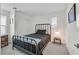 Cozy bedroom featuring a metal bed frame and ample closet space at 6867 Evening Orchid St, North Las Vegas, NV 89086
