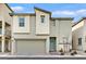 Two-story modern home with attached garage and landscaping at 6867 Evening Orchid St, North Las Vegas, NV 89086