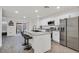Modern kitchen with granite countertops, stainless steel appliances, and island at 6867 Evening Orchid St, North Las Vegas, NV 89086