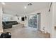 Open concept living space with access to backyard and kitchen view at 6867 Evening Orchid St, North Las Vegas, NV 89086