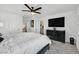 Main bedroom with king bed, large TV, and walk-in closet at 6867 Evening Orchid St, North Las Vegas, NV 89086