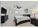 Large main bedroom with a king-size bed and ample dresser space at 6867 Evening Orchid St, North Las Vegas, NV 89086