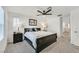 Comfortable main bedroom with a king-size bed and ceiling fan at 6867 Evening Orchid St, North Las Vegas, NV 89086
