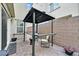 Private patio with covered pergola and seating area at 6867 Evening Orchid St, North Las Vegas, NV 89086