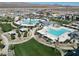 Community pool area with expansive green space at 6867 Evening Orchid St, North Las Vegas, NV 89086