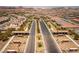 Aerial view of community with well manicured green spaces divided by the main road at 723 Orange Plume Walk # 0, Henderson, NV 89011