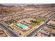 Overhead view of the community clubhouse and recreational areas, including pool, sport courts, and adjacent residential blocks at 723 Orange Plume Walk # 0, Henderson, NV 89011