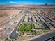 A stunning view of the community featuring a park, tennis courts, and single-Gathering homes at 723 Orange Plume Walk # 0, Henderson, NV 89011