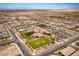 A grand aerial perspective of the community's impressive clubhouse, swimming pool, manicured lawns, and organized residential layout at 723 Orange Plume Walk # 0, Henderson, NV 89011