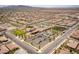 Expansive aerial view of community center, ample parking, green spaces, and a multitude of single-Gathering homes at 723 Orange Plume Walk # 0, Henderson, NV 89011