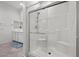 Modern bathroom featuring a glass-enclosed shower, bench and a grab bar at 723 Orange Plume Walk # 0, Henderson, NV 89011