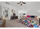 Bright bedroom featuring colorful floral bedding and a decorative mirror at 723 Orange Plume Walk # 0, Henderson, NV 89011