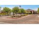 Stunning curb view of The Club at Heritage with manicured landscaping and a grand entrance at 723 Orange Plume Walk # 0, Henderson, NV 89011